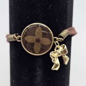 Upcycled Louis Vuitton Bracelet With Bow Charm In The Color Gold